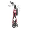 The compact R726 red walker stands upright with black handles, wheels, a seat, and a backrest—designed for easy storage or transport.