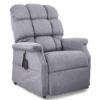 The Golden Technologies®️ Cambridge PR 401 is a plush gray reclining chair featuring padded armrests, a tufted backrest, and an attached remote control for adjusting the recline. It is displayed against a plain background.