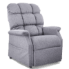 The Golden Technologies®️ Cambridge PR 401 is a plush, light gray recliner chair featuring a high back, cushioned armrests, and tufted upholstery. It looks exceedingly comfortable against the plain white background.