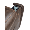 Close-up of the Titan PR 448s brown leather recliner armrest, highlighting the visible stitching and integrated slot holding a smartphone.
