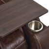Close-up of the Golden Technologies®️ Titan with Twilight PR 449 armrest, showcasing its built-in silver cup holder and dark wooden tray. The brown leather displays visible stitching and a textured surface.