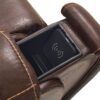 The Golden Technologies®️ Titan with Twilight PR 449 is a brown leather recliner chair featuring prominent stitching, a visible armrest compartment, and an inside black wireless charging pad.