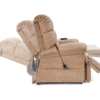 A side view of the Golden Technologies®️ Cloud PR 510 displays its tan upholstery and three reclining positions, featuring a padded backrest, armrests, a retractable footrest, and an attached remote control with a cord.