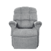 The Golden Technologies®️ Cloud PR 510 is a plush grey recliner featuring cushioned armrests and a high backrest, offering exceptional comfort. It stands against a white background, showcasing its soft fabric and padded design.