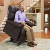 The Golden Technologies®️ Comforter with ZG+ PR 545 is a relaxing, dark brown reclining chair featuring a thick cushioned backrest and armrests, slightly tilted for comfort. It has a sturdy base designed for excellent support and relaxation.