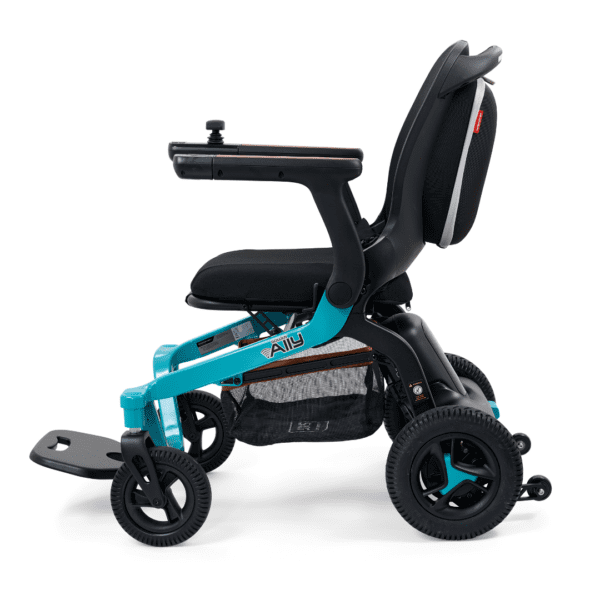 The Golden Ally Power Wheelchair has a turquoise frame, black seat, joystick on the armrest, four sturdy wheels, and a foldable footrest. Its compact and lightweight design makes it convenient for use.