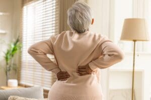 senior woman struggling with back pain